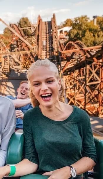 Woman riding rollercoaster experience